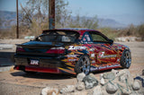 Nissan S14.9 240SX drift car rear view with red and black 2F Performance livery, aftermarket wheels, racing decals.